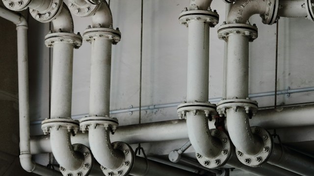 Dense industrial piping with flanges and valves
